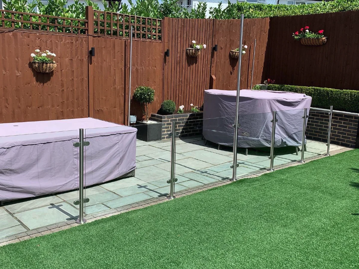 Frameless outdoor glass balustrade on lawn edge, Maidstone Glass Balustrades Headcorn Weald installation