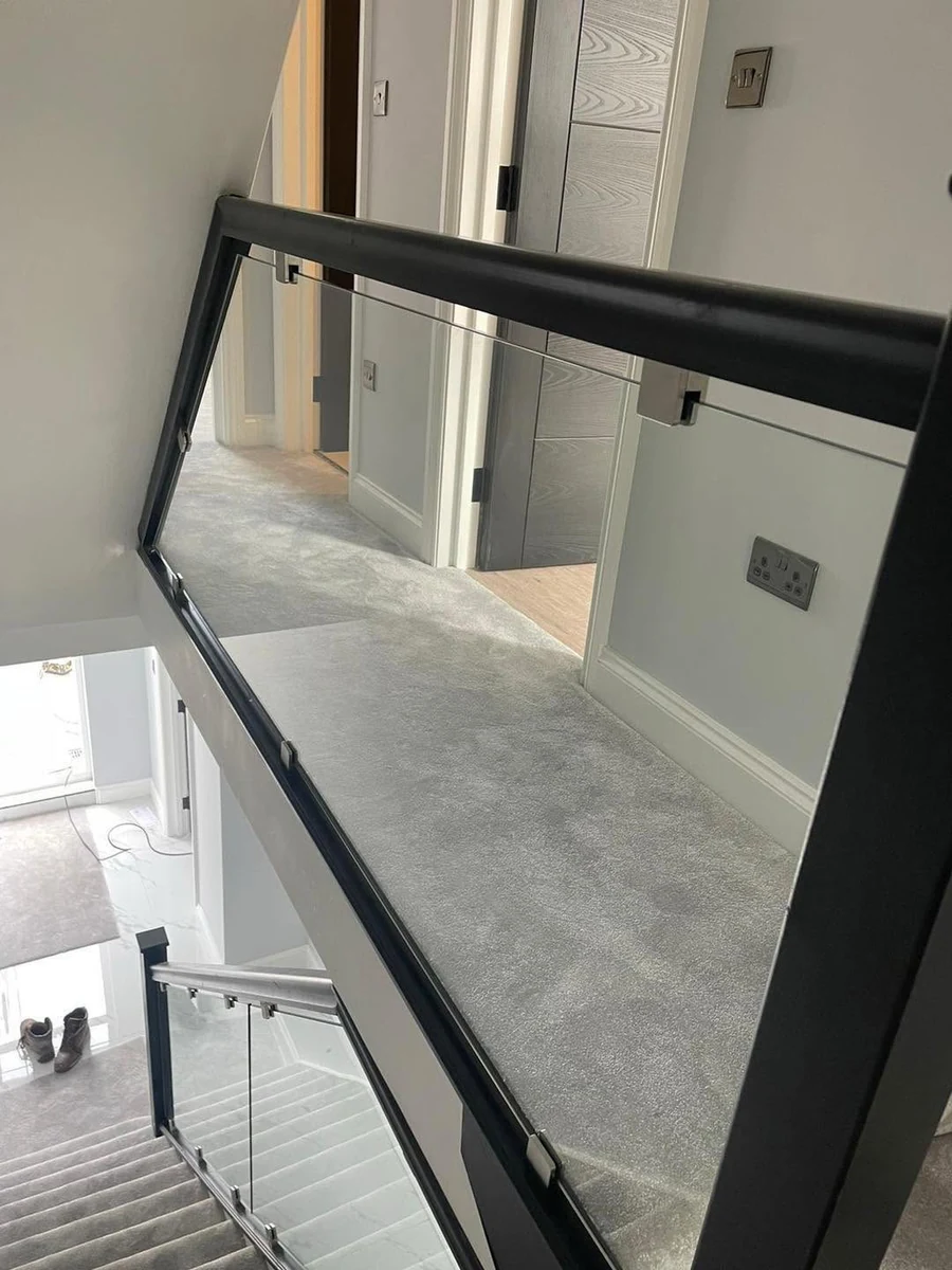 Black handrail glass balustrade at first-floor landing, Maidstone Glass Balustrades