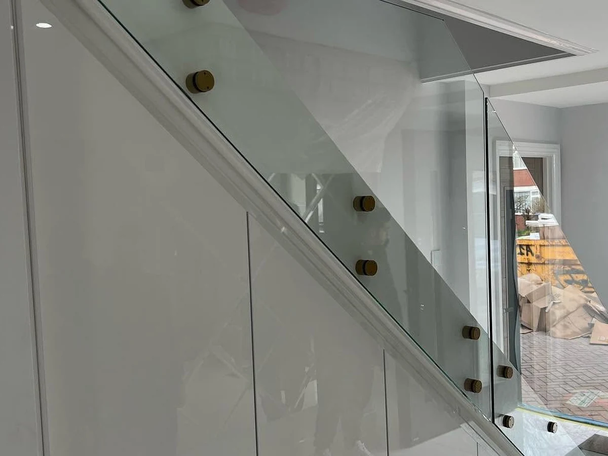 Staircase glass balustrade with bronze standoff fixings, Maidstone Glass Balustrades residential installation