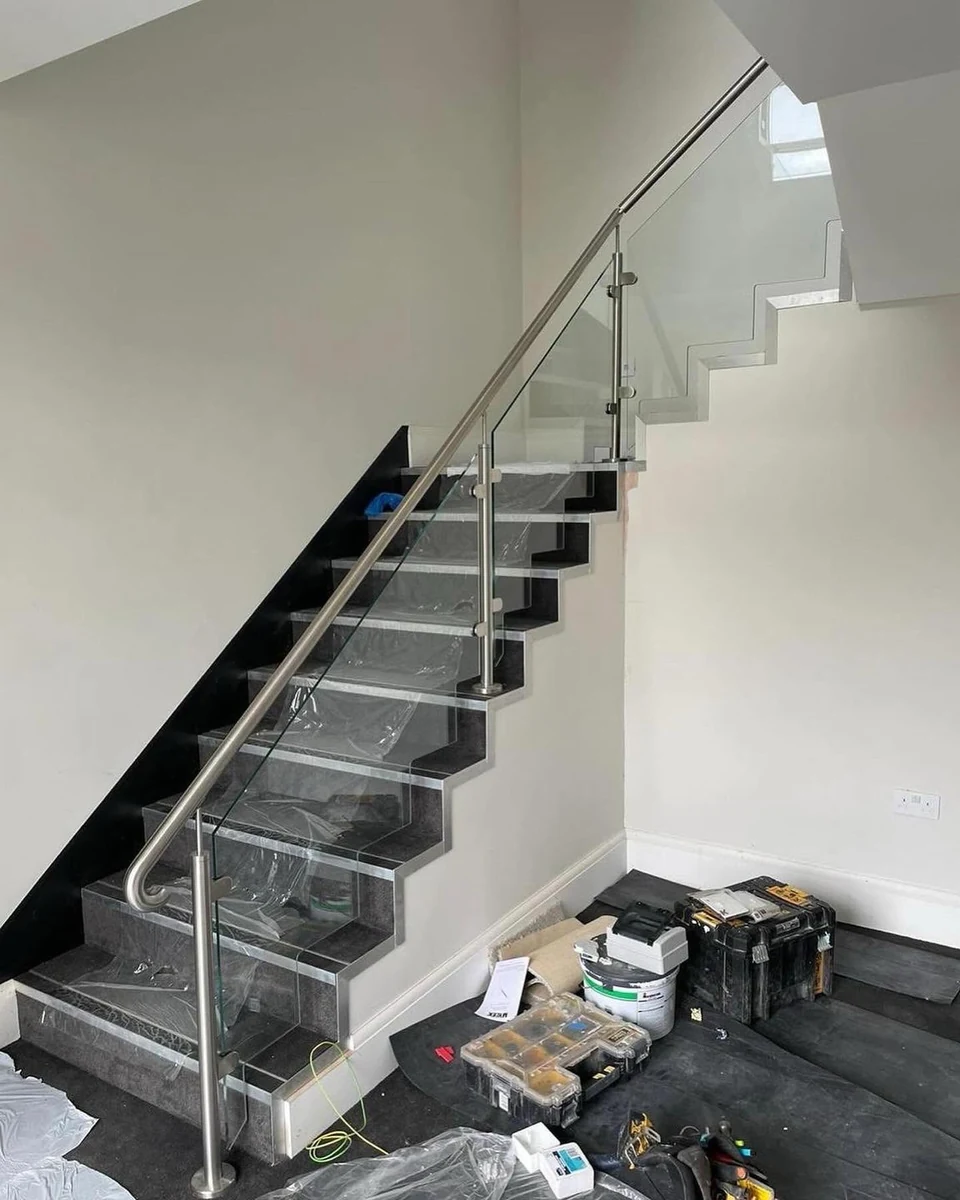 Frameless glass balustrade on floating stone staircase, Maidstone Glass Balustrades installation