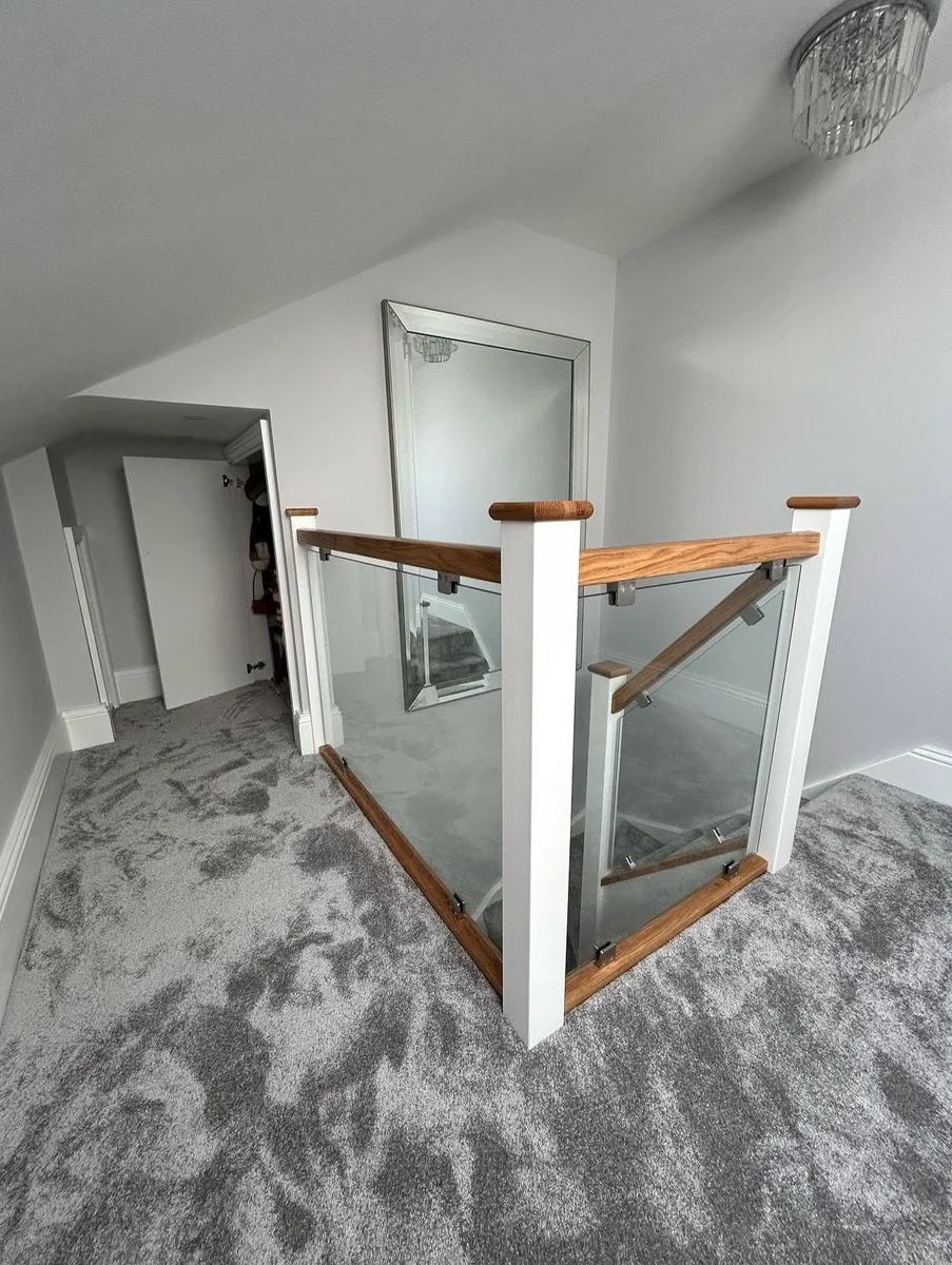 Oak handrail glass balustrade at stair corner, Maidstone Glass Balustrades North Downs farmhouse