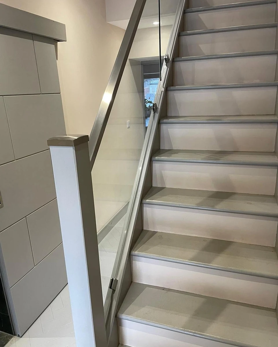 Glass balustrade on stone tread tiled staircase, Maidstone Glass Balustrades installation